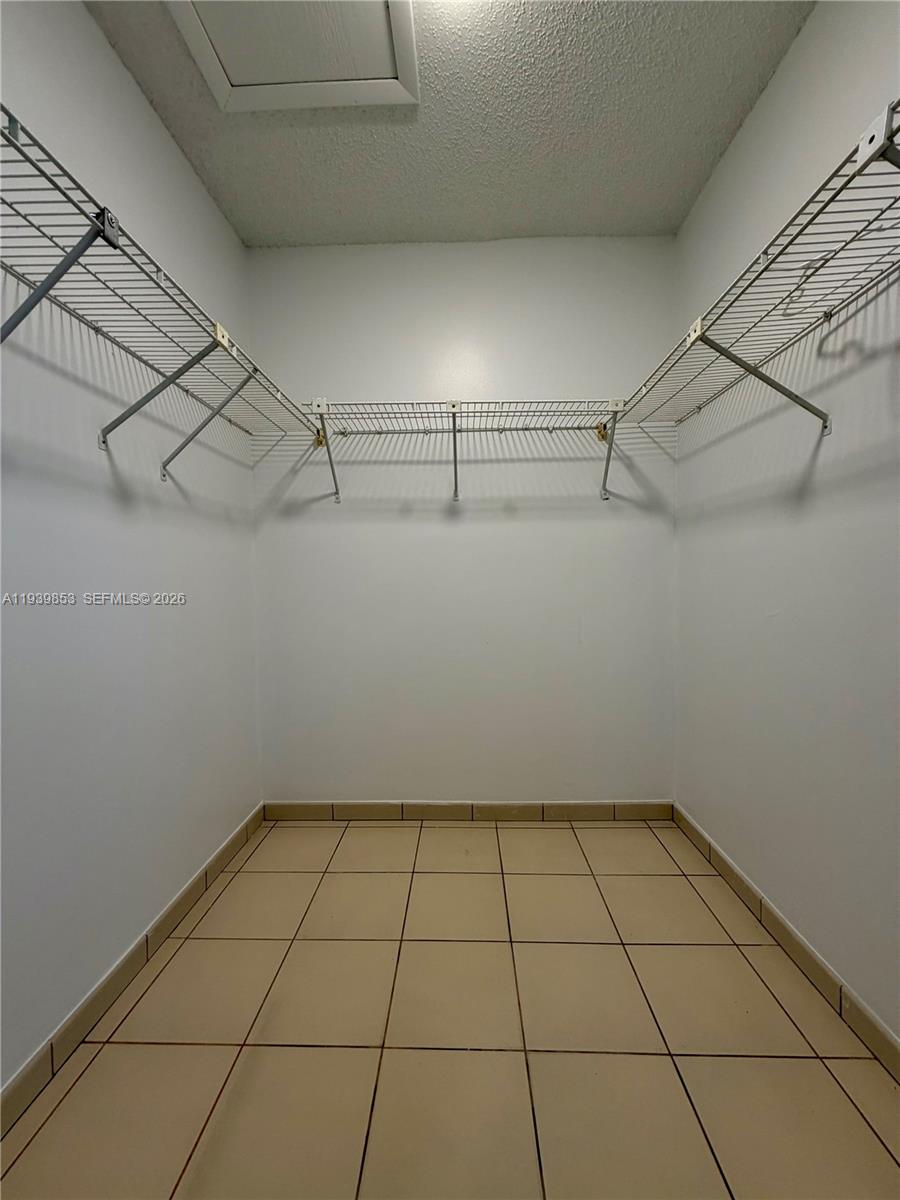 9064 Southwest 6th Street, Unit 9064 Miami, FL 33174 - Photo 11 of 20 a view of a room with racks on the wall
