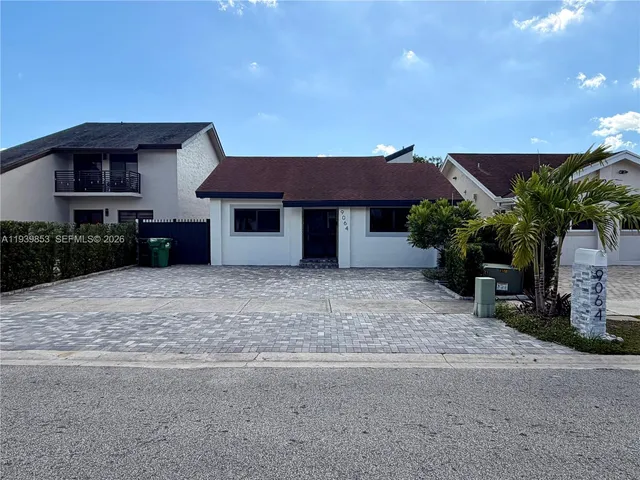 a house view with a garden space