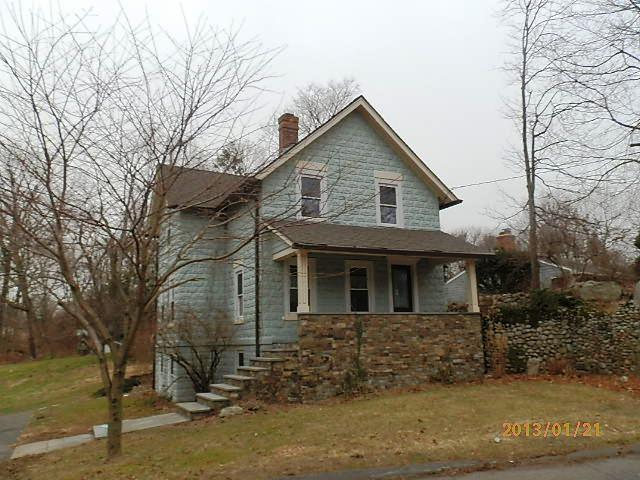 7 Blake Street Norwalk, CT 06851 - Photo 1 of 1 a front view of a house with a yard