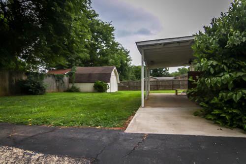 218 Hampton Road Columbia, TN 38401 - Photo 4 of 4 covered patio, Large outbuilding, Privacy fence
