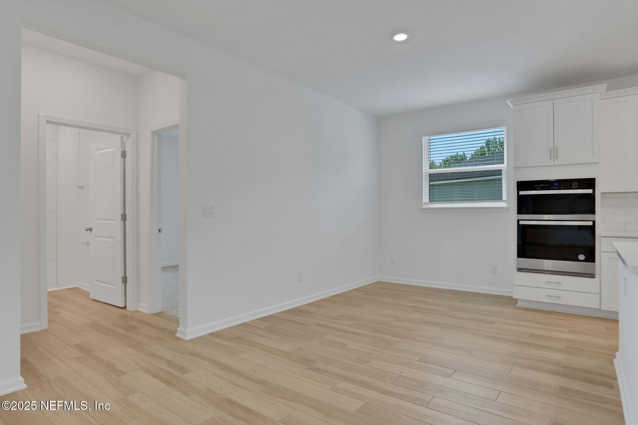 317 Archstone Way St. Augustine, FL 32092 - Photo 22 of 46 a view of an empty room with a kitchen