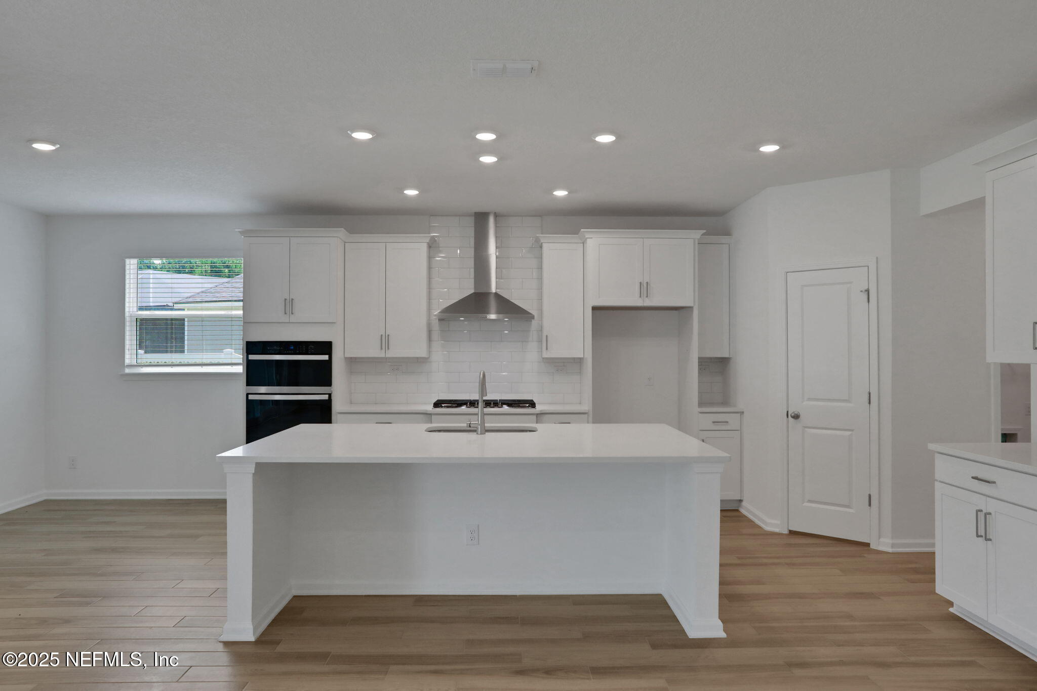 317 Archstone Way St. Augustine, FL 32092 - Photo 27 of 46 a large kitchen with stainless steel appliances a large counter top and a stove