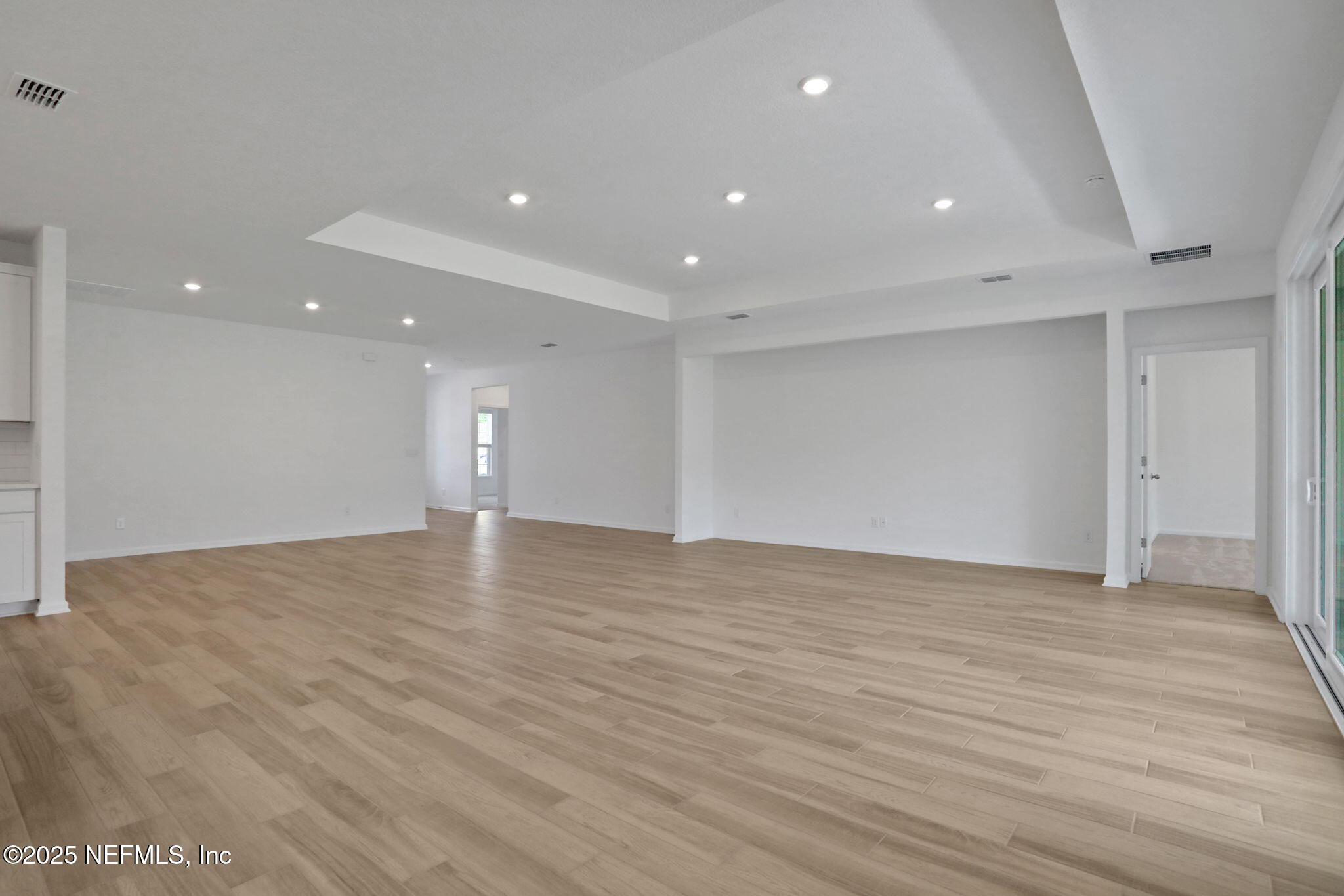 317 Archstone Way St. Augustine, FL 32092 - Photo 38 of 46 a view of an empty room with wooden floor and closet