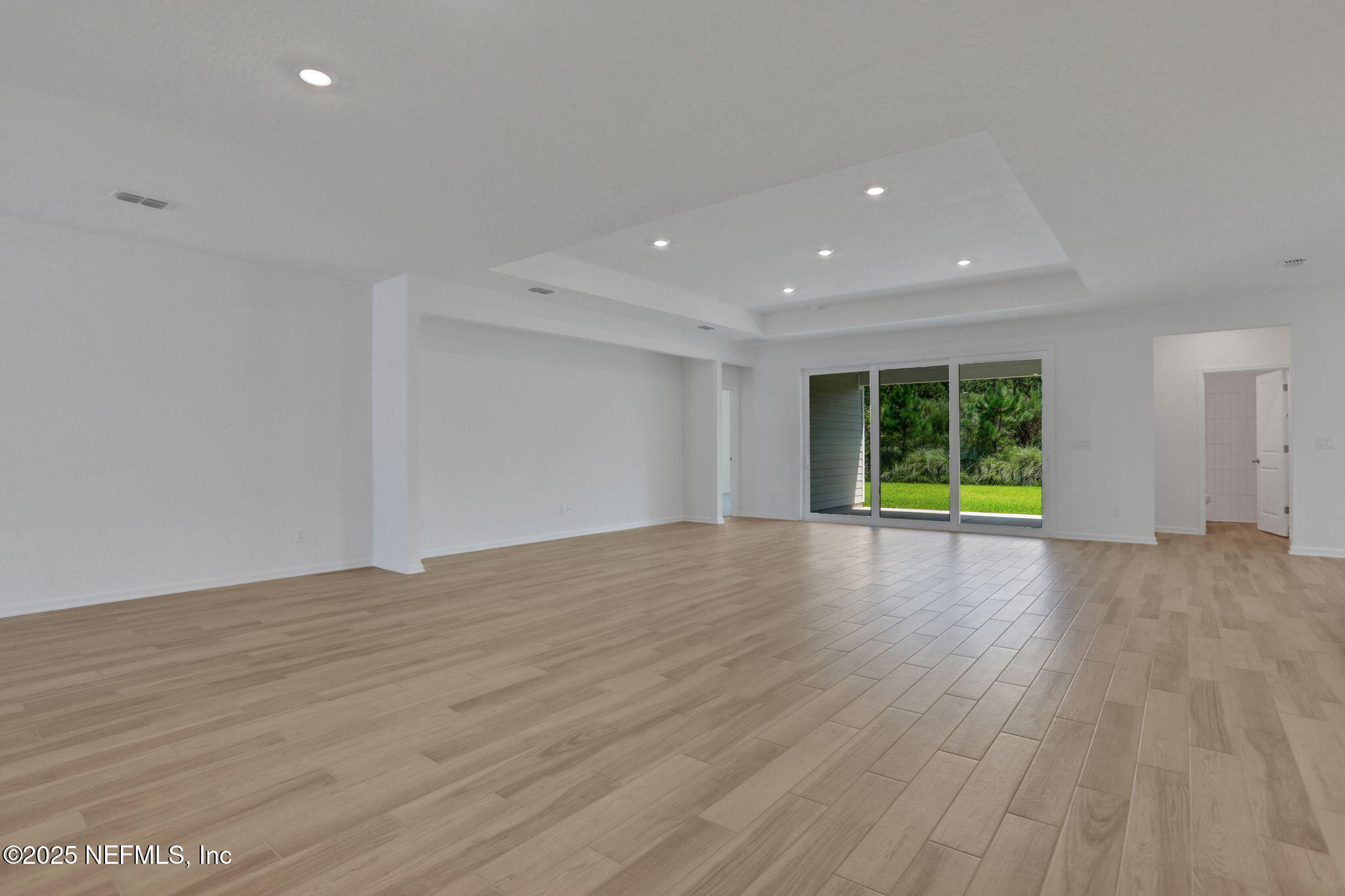 317 Archstone Way St. Augustine, FL 32092 - Photo 39 of 46 a view of empty room with wooden floor and fan