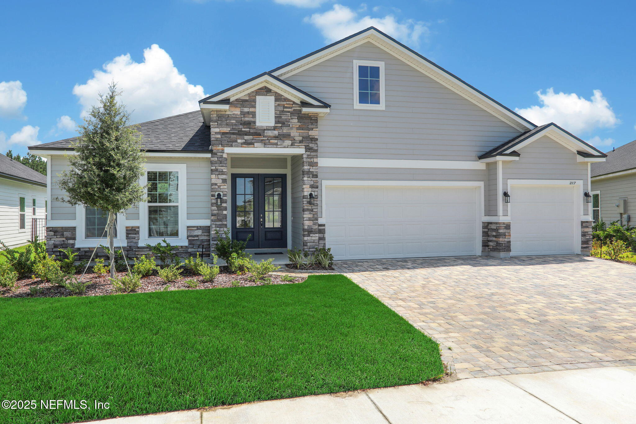 317 Archstone Way St. Augustine, FL 32092 - Photo 4 of 46 a front view of house with yard and green space