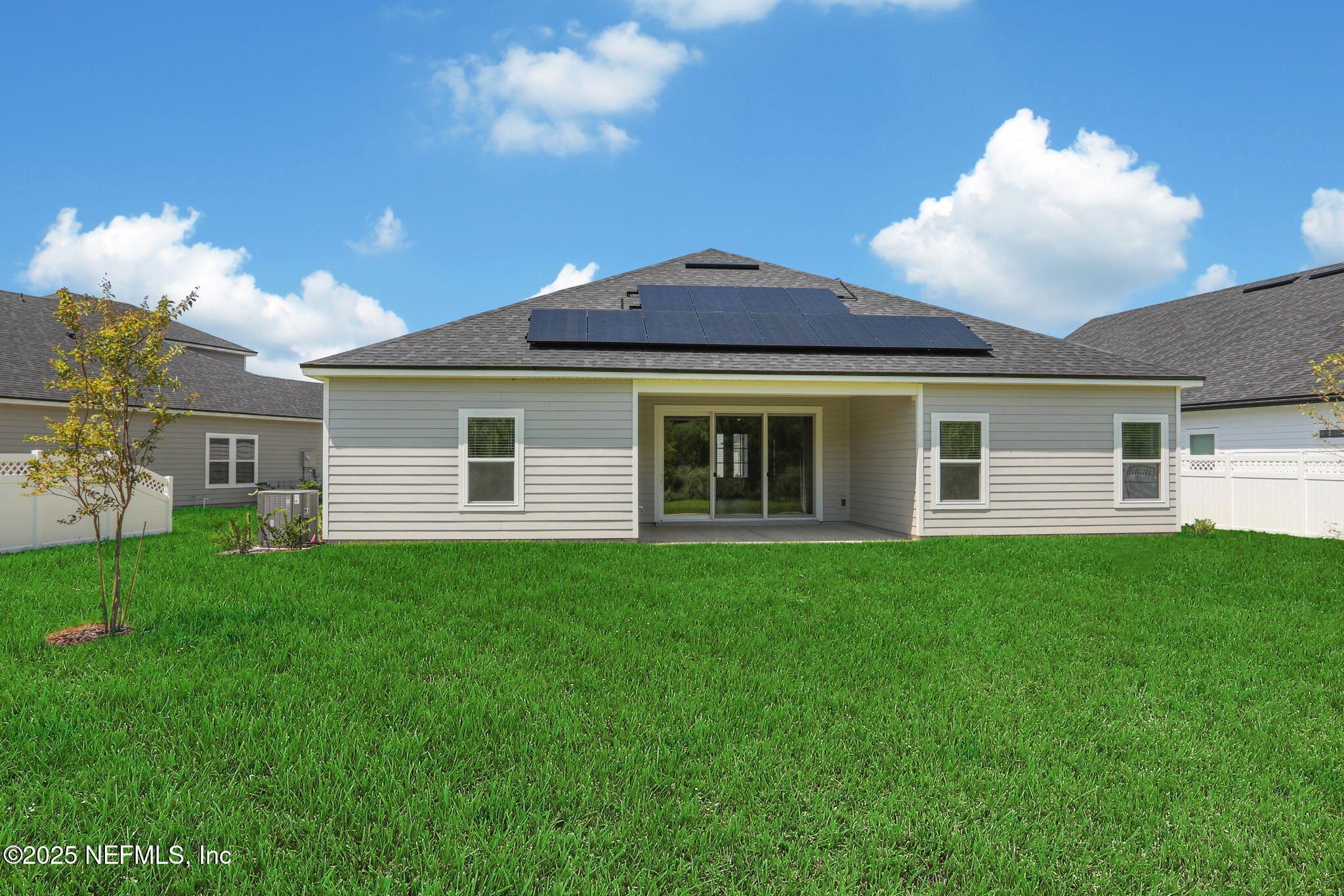 317 Archstone Way St. Augustine, FL 32092 - Photo 8 of 46 a front view of a house with a garden