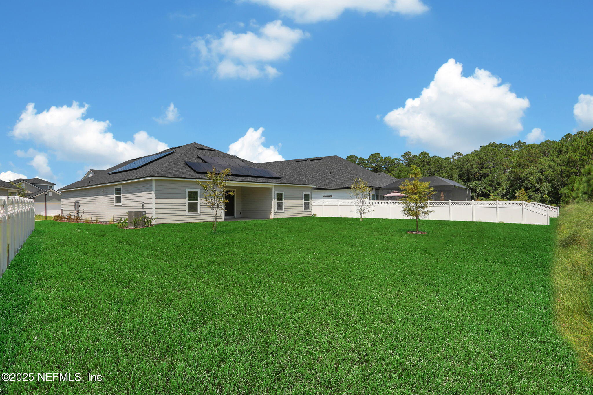 317 Archstone Way St. Augustine, FL 32092 - Photo 9 of 46 a view of a house with a big yard