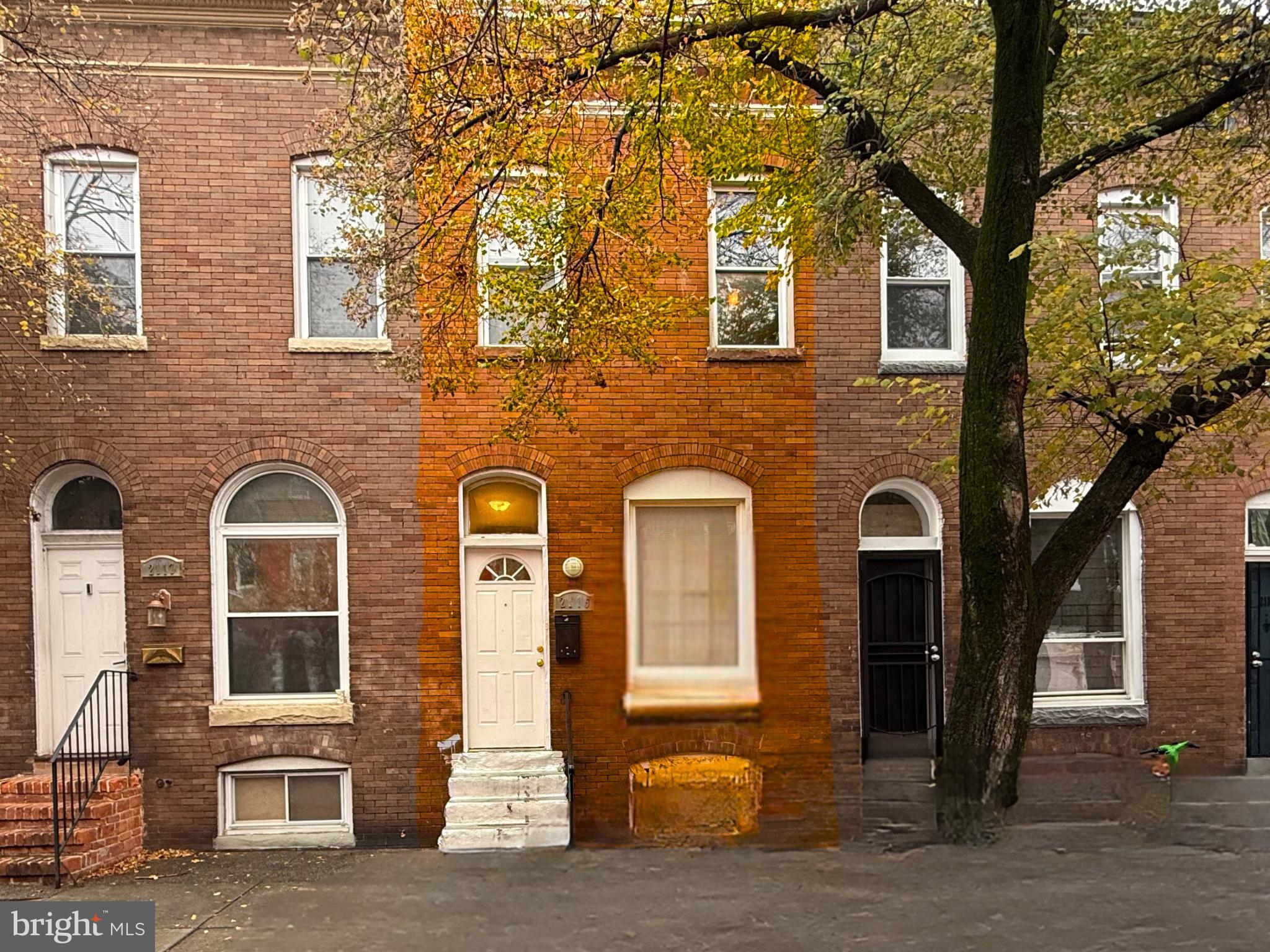 Front of home. Board/car edited out.