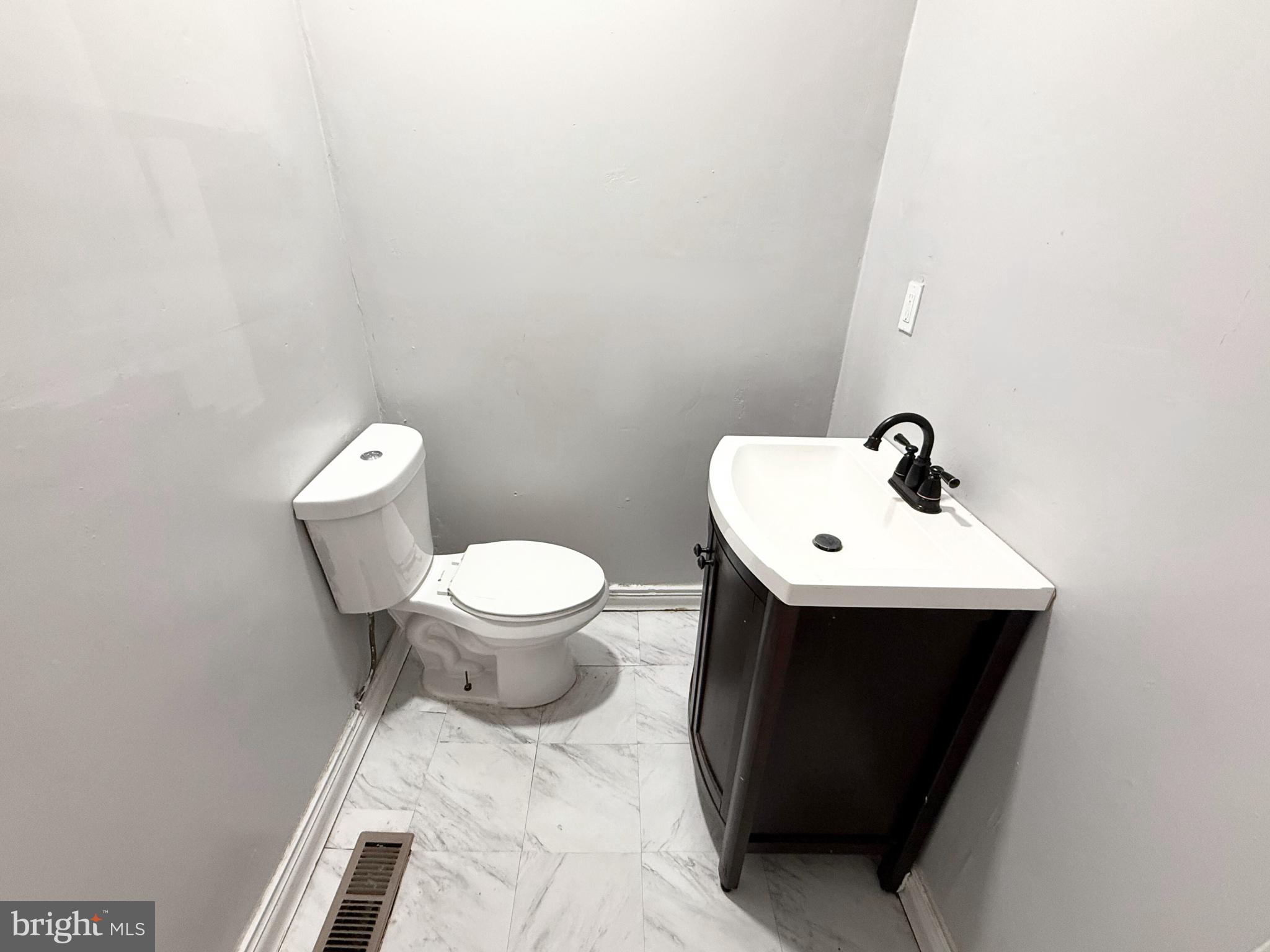 2115 McCulloh Street Baltimore, MD 21217 - Photo 6 of 22 Updated half bathroom.