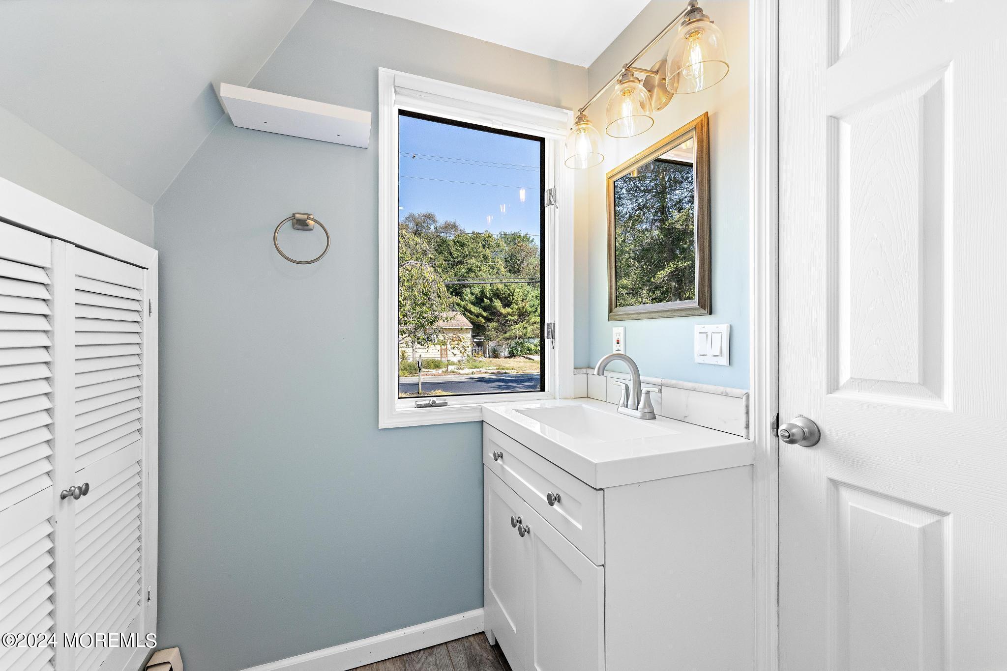 32 Barnegat Beach Drive Waretown, NJ 08758 - Photo 37 of 49 a bathroom with a sink and a vanity