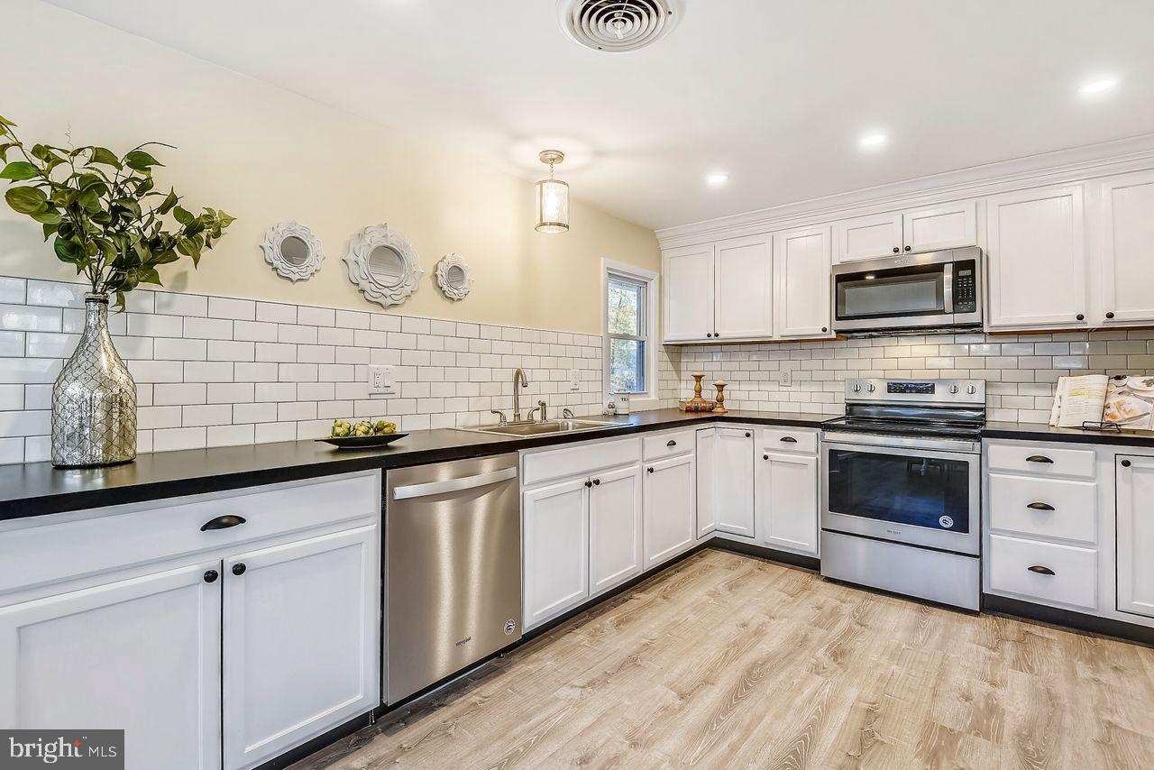 278 North Ferry Point Road Pasadena, MD 21122 - Photo 2 of 36 Modern kitchen with ample cabinetry
