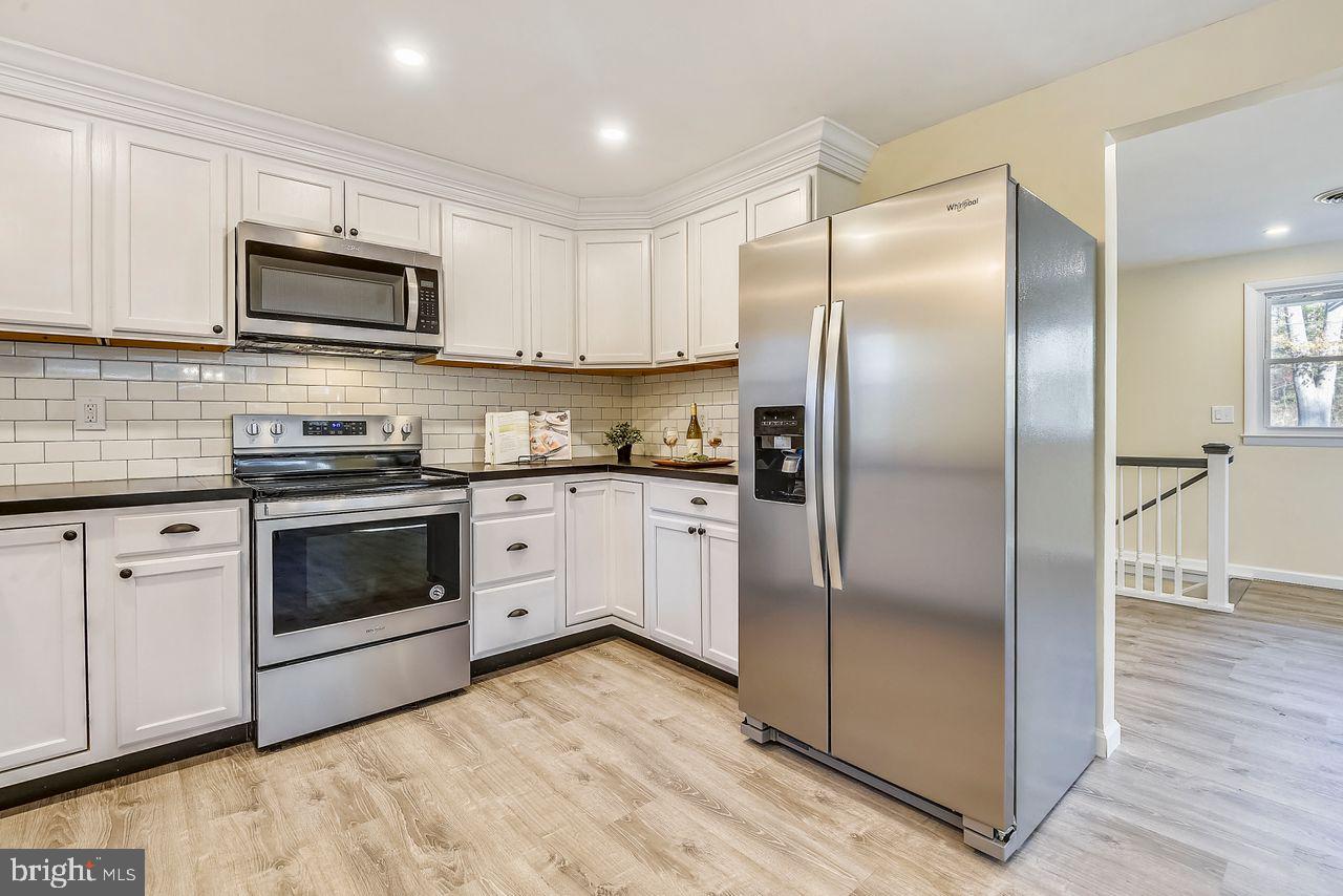 278 North Ferry Point Road Pasadena, MD 21122 - Photo 9 of 36 Kitchen features all new stainless appliances