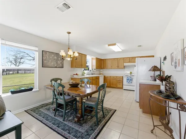a kitchen with a sink cabinets and window