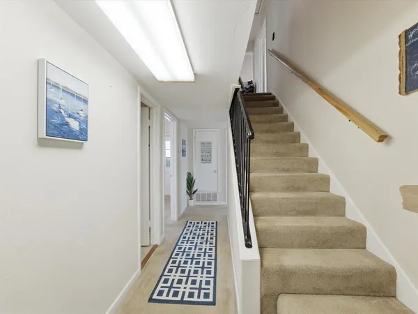 a bedroom with bed and window