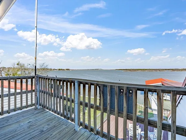 a bathroom with a tub sink toilet and a mirror