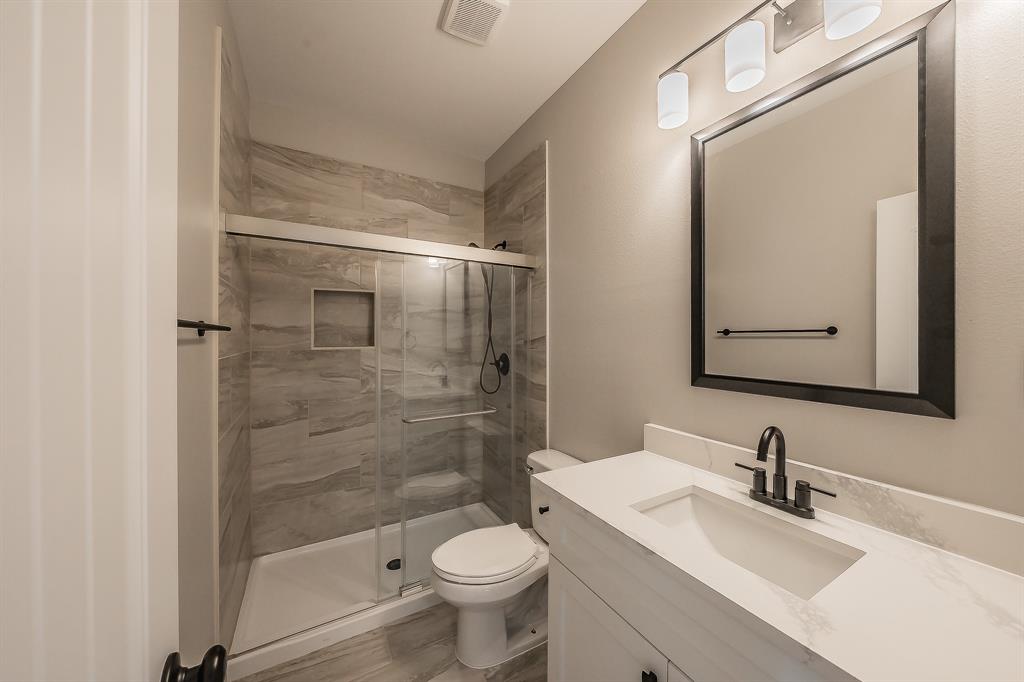 412 Hideaway Road McKinney, TX 75072 - Photo 32 of 40 a bathroom with a sink and a mirror