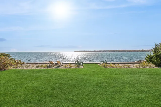 a view of a city with lawn chairs and a big yard