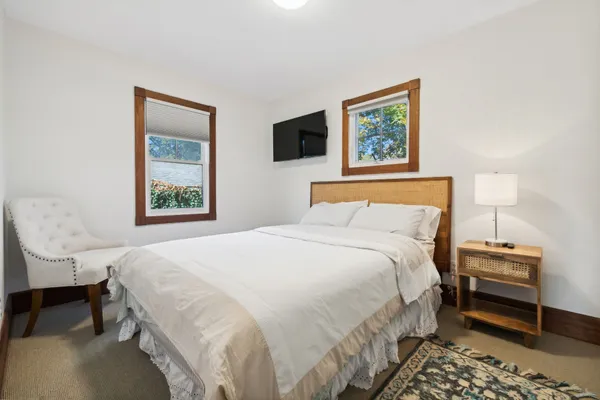 a bedroom with bed and a window