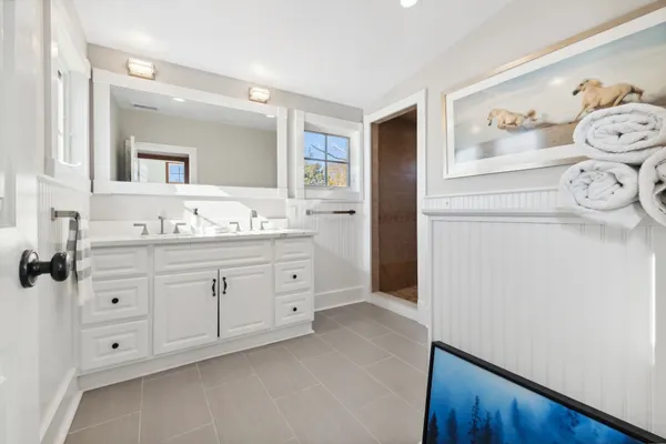 a bathroom with a bathtub and shower