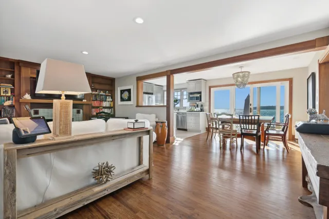 a living room with furniture a table and chairs