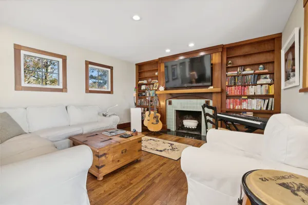 a living room with furniture and a fireplace
