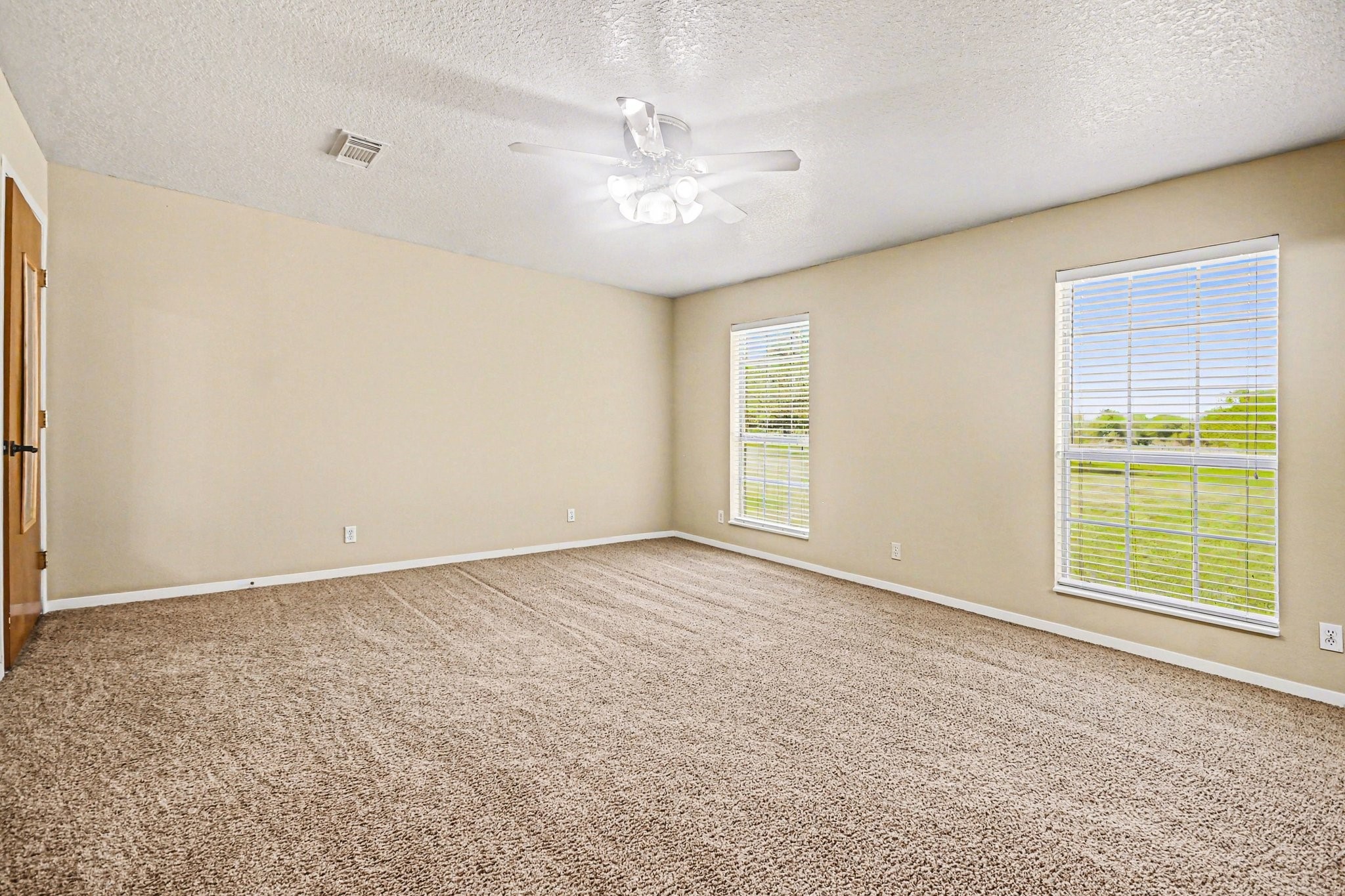 21503 Pecan Bend Road Damon, TX 77430 - Photo 17 of 45 a view of an empty room with a window