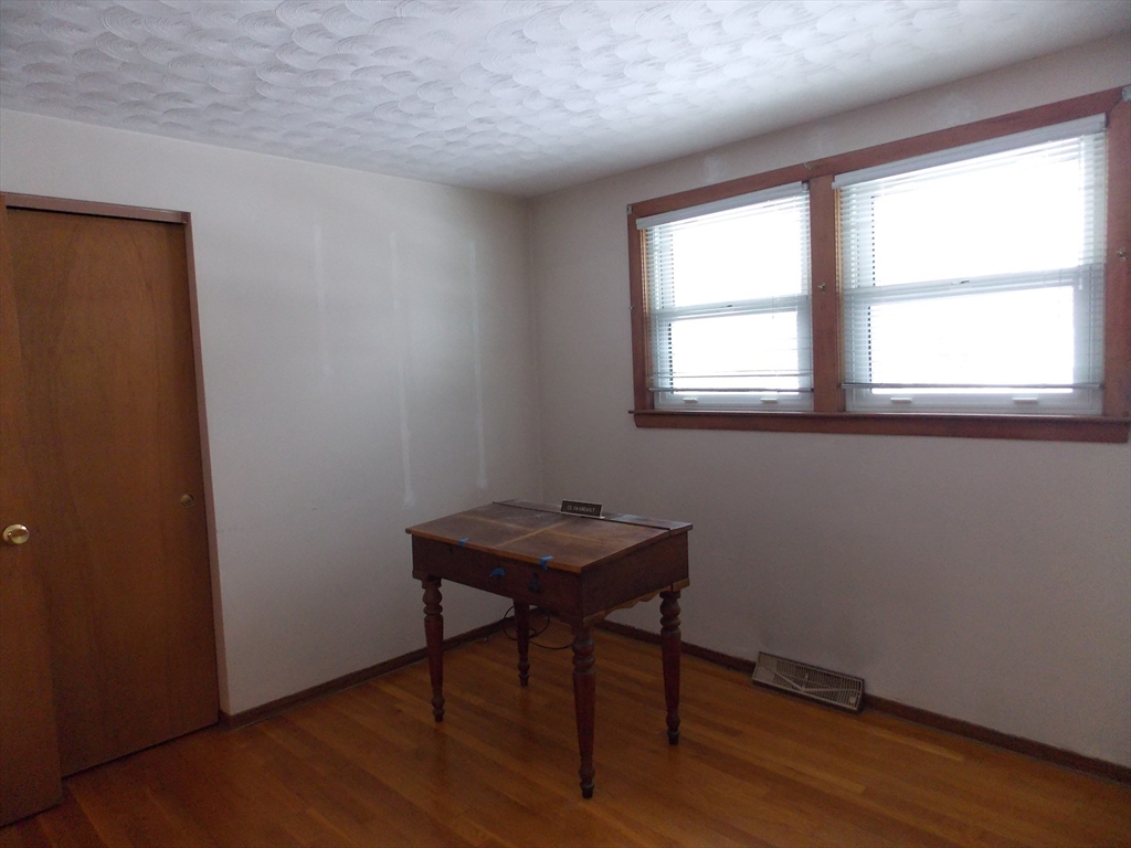 26 Old Bolton Road Hudson, MA 01749 - Photo 11 of 19 a room with a table and a window