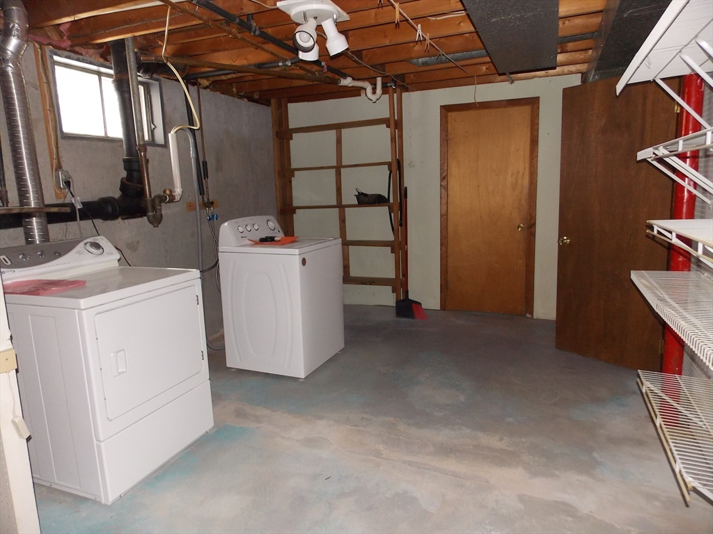26 Old Bolton Road Hudson, MA 01749 - Photo 15 of 19 a view of storage and utility room with washer and dryer