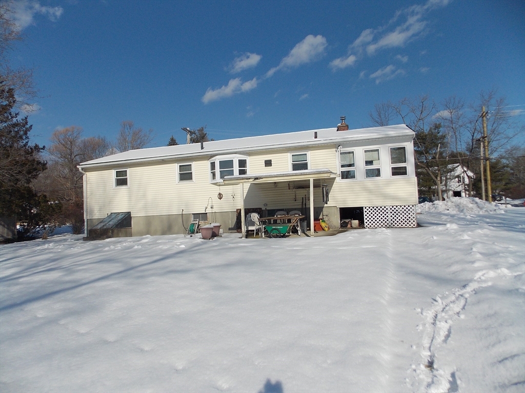 26 Old Bolton Road Hudson, MA 01749 - Photo 18 of 19 a view of a house with a patio