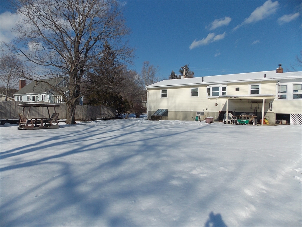 26 Old Bolton Road Hudson, MA 01749 - Photo 19 of 19 a view of a building with a bench in front of house