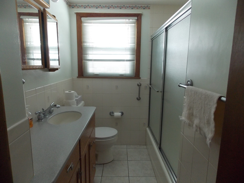 26 Old Bolton Road Hudson, MA 01749 - Photo 7 of 19 a bathroom with a granite countertop sink toilet and shower