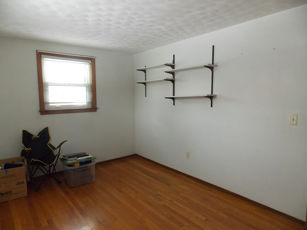 26 Old Bolton Road Hudson, MA 01749 - Photo 10 of 19 wooden floor in an empty room