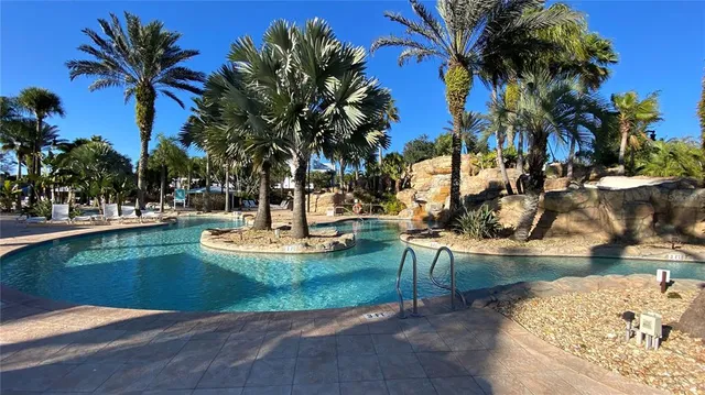 a view of a swimming pool with a patio