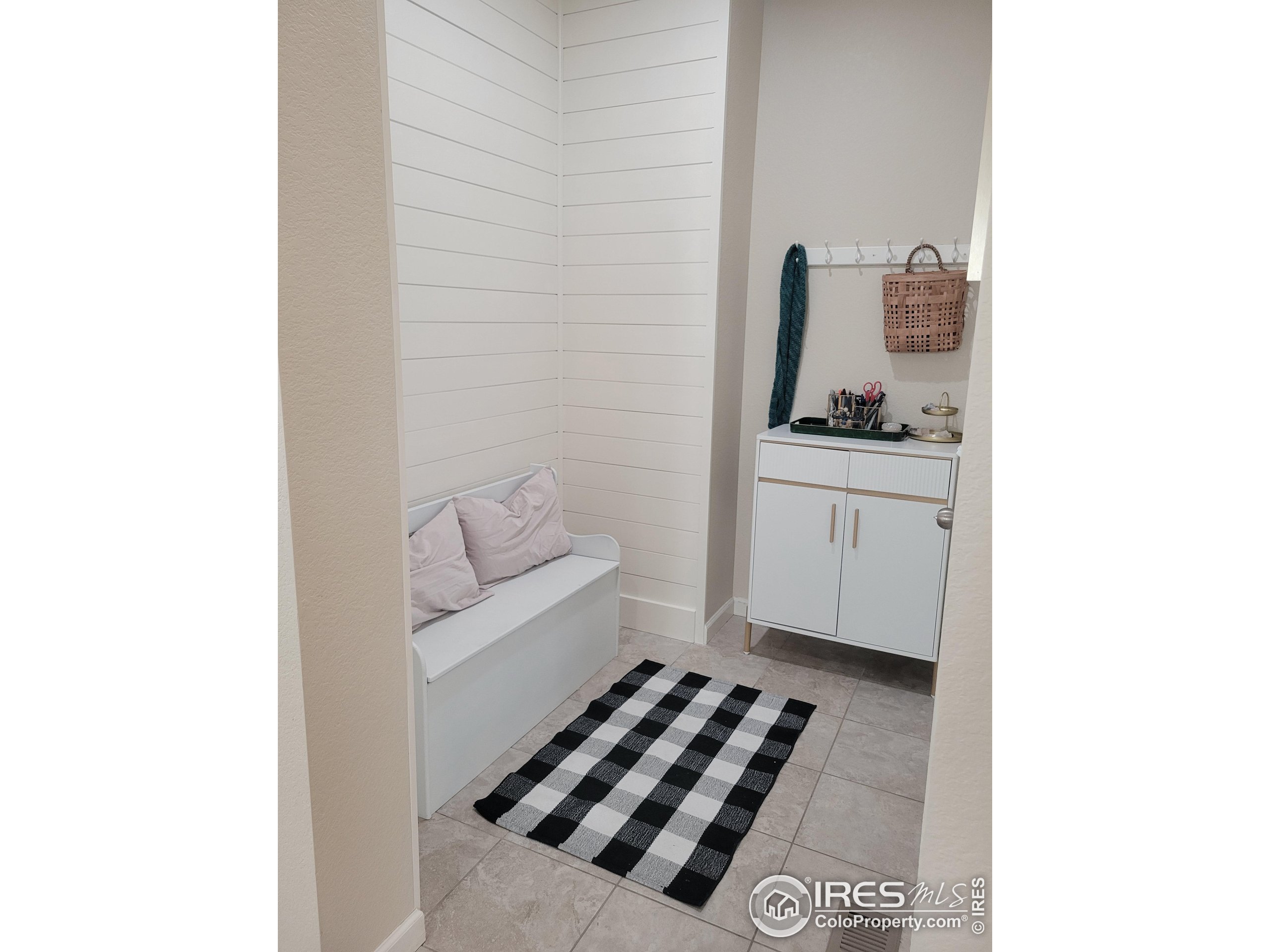 6770 Spring Rain Road Timnath, CO 80547 - Photo 16 of 30 a living room with a couch and a stove top oven