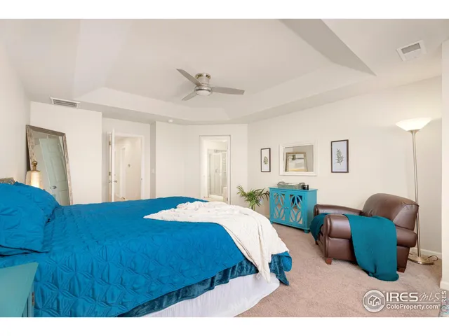 a bed room with a bed and a couch