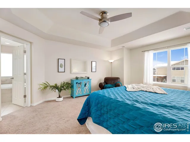 a bed room with furniture and a wooden floor