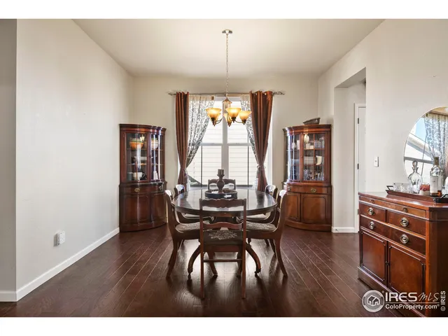 a view of a dining room with furniture and window