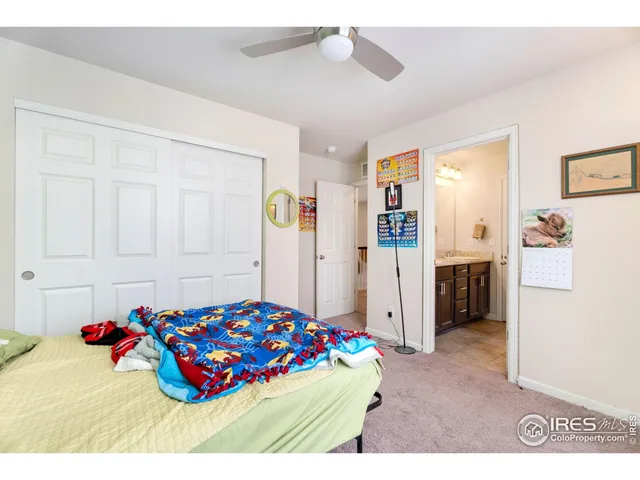 a bedroom with furniture and a chandelier