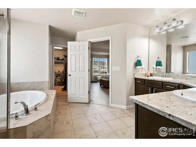 a living room with furniture and a dining table