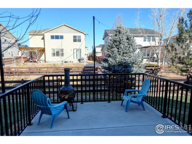 a view of a chairs and table in the balcony