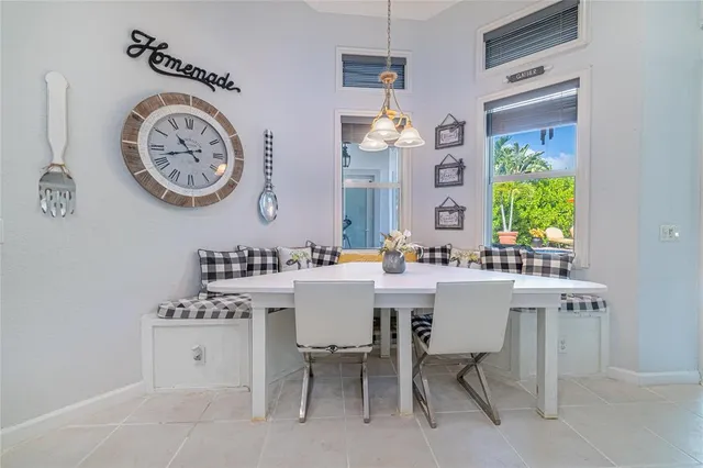 an aerial view of a house with a garden and lake view