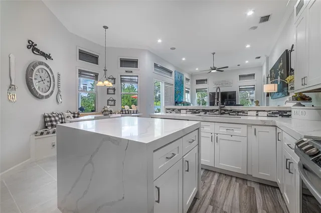an aerial view of lake and residential houses with outdoor space