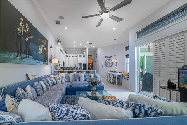 a spacious bedroom with a bed a dresser and a large mirror