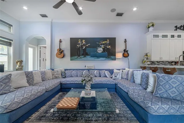 a bathroom with a tub a sink and a window