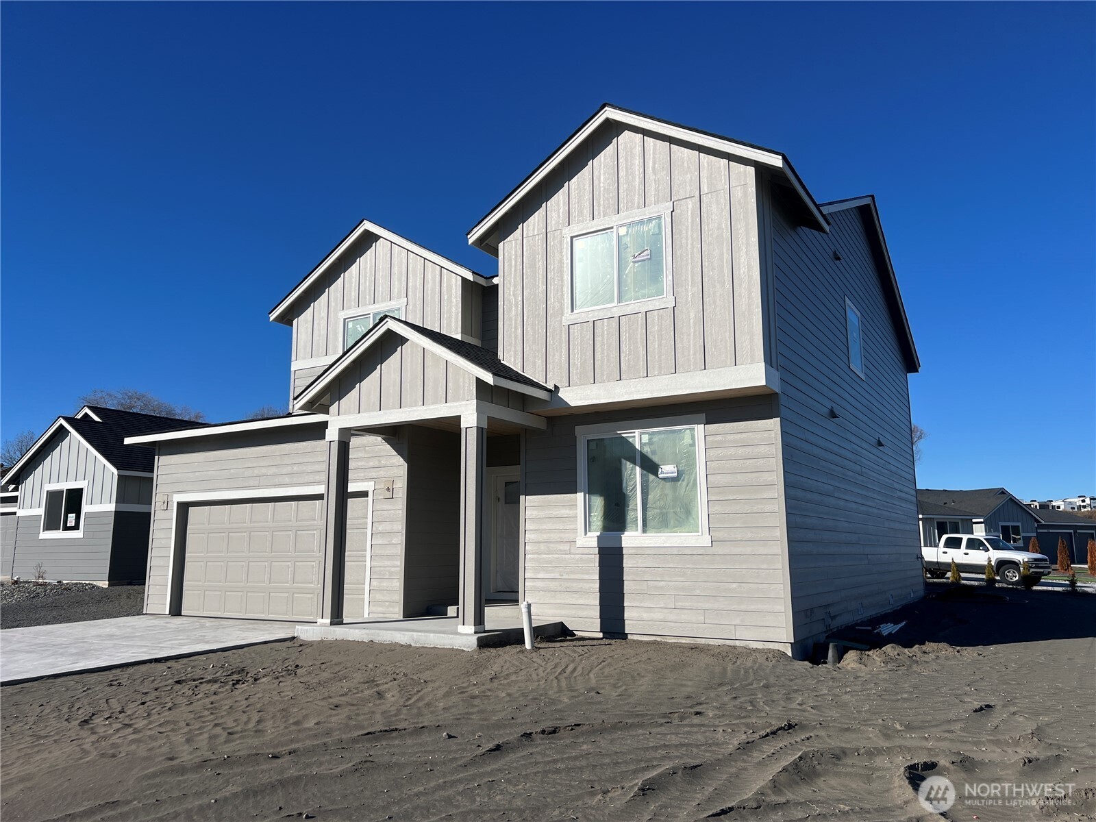494 North Ruddy Street Moses Lake, WA 98837 - Photo 2 of 19 a front view of a house with a yard and garage
