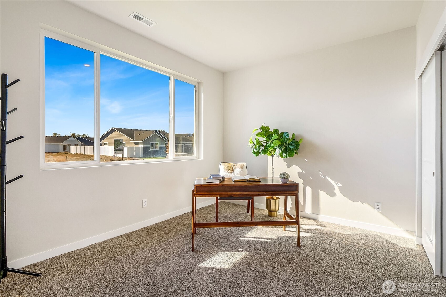 494 North Ruddy Street Moses Lake, WA 98837 - Photo 9 of 19 a view of a room with a window and a potted plant