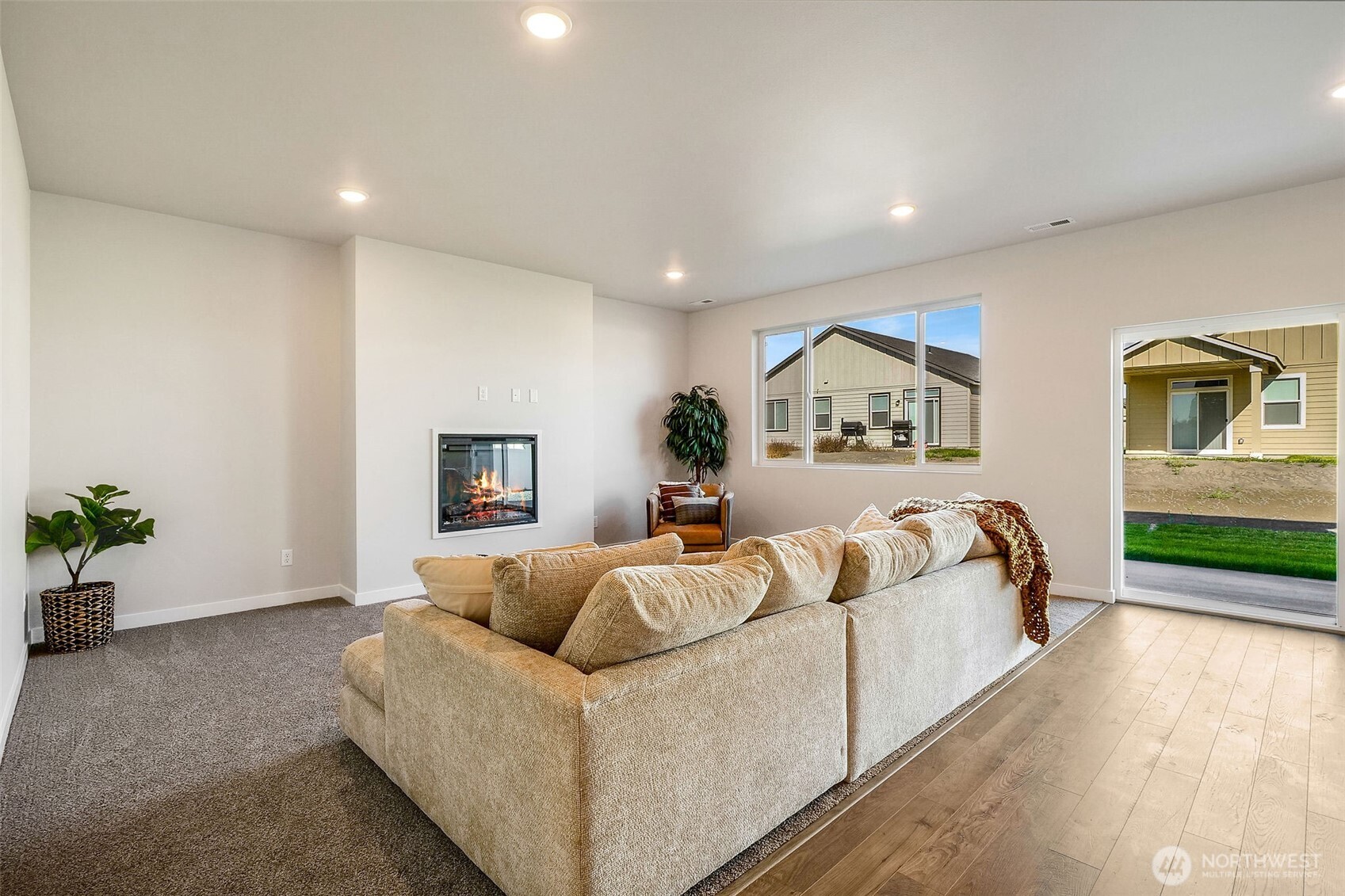 494 North Ruddy Street Moses Lake, WA 98837 - Photo 10 of 19 a spacious bedroom with a large bed and a couch