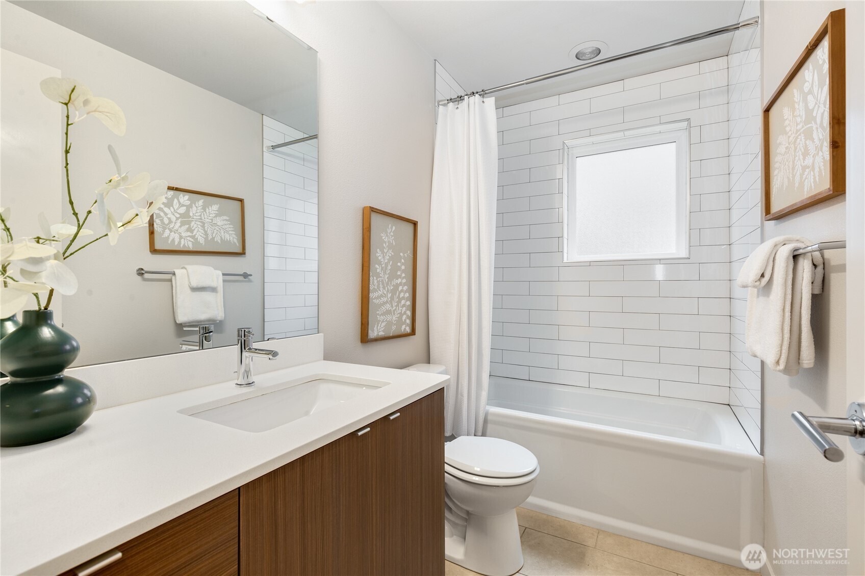 4272 Southwest Bradford Street Seattle, WA 98116 - Photo 18 of 28 a bathroom with a sink a toilet and shower