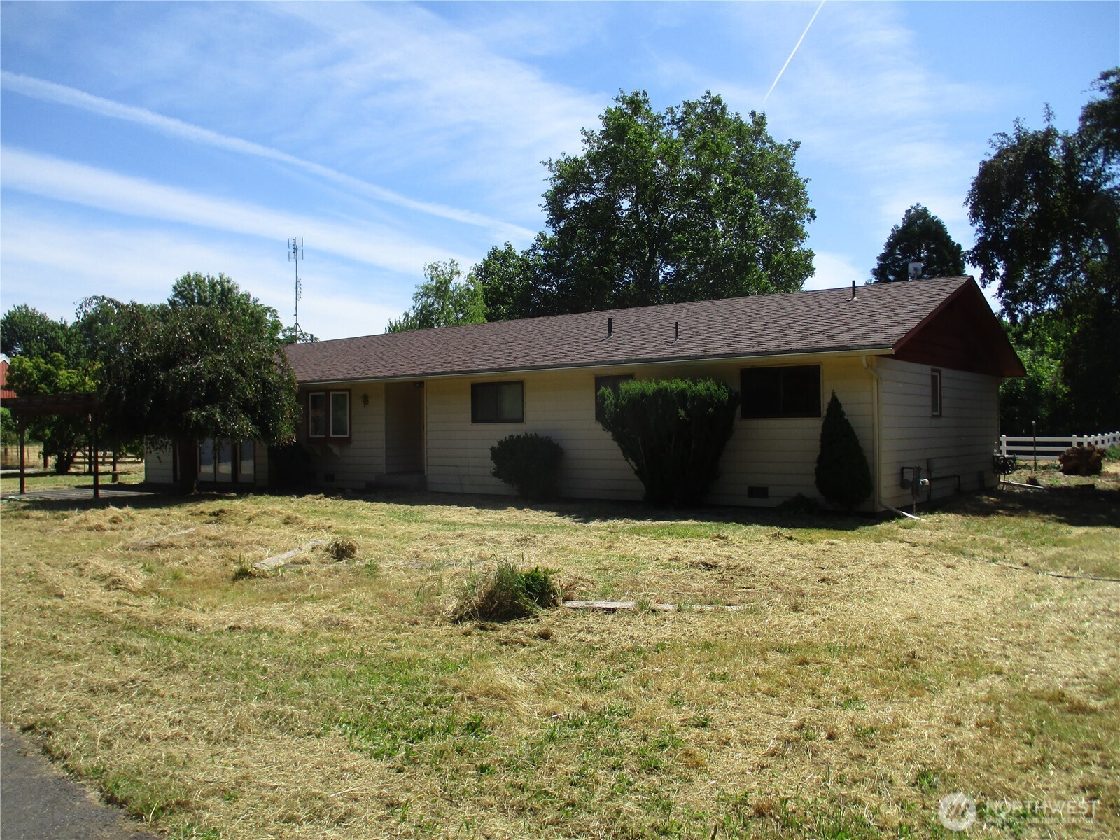 2499 Cottonwood Road Walla Walla, WA 99362 - Photo 4 of 19 a house with trees in front of it