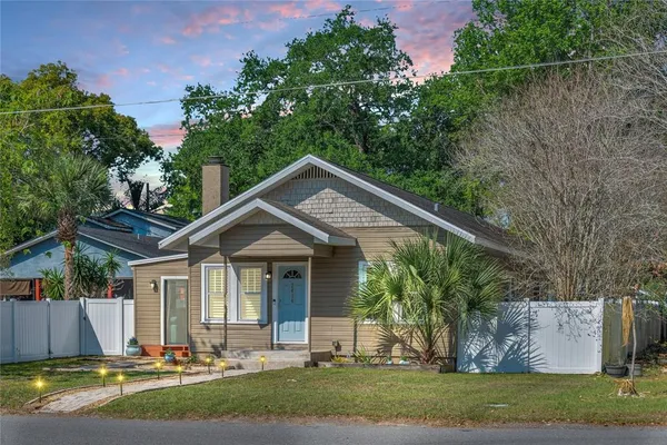 front view of a house with a yard